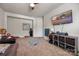 Spacious bedroom featuring neutral carpet, a large television, and a playful decorative theme at 5088 Watersail Way, Clover, SC 29710