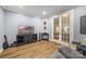 Comfortable bonus room with textured wall, hardwood floors, and modern decor at 5088 Watersail Way, Clover, SC 29710