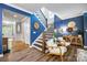 Inviting entryway showcasing a staircase, stylish decor, and hardwood floors at 5088 Watersail Way, Clover, SC 29710