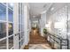 Elegant hallway featuring hardwood floors, decorative accents, and a view into the living areas at 5088 Watersail Way, Clover, SC 29710