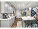 Well-equipped kitchen features a spacious island, modern appliances, stylish pendant lighting, and ample storage space at 5088 Watersail Way, Clover, SC 29710