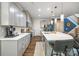 Well-equipped kitchen with ample counter space, modern appliances, and stylish gray cabinetry, open to dining at 5088 Watersail Way, Clover, SC 29710