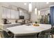 Bright kitchen with white countertops, stainless steel appliances, and a large island with barstools at 5088 Watersail Way, Clover, SC 29710
