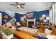 Inviting living room featuring a fireplace, staircase, hardwood floors, comfortable seating, and stylish decor for a cozy atmosphere at 5088 Watersail Way, Clover, SC 29710