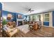 Cozy living room with a fireplace, hardwood floors, and plenty of natural light at 5088 Watersail Way, Clover, SC 29710