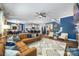 Open-concept living area featuring a comfortable seating arrangement, and an open floor plan with hardwood floors at 5088 Watersail Way, Clover, SC 29710