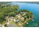 Stunning aerial view of waterfront homes nestled among lush trees with private docks along a picturesque lake at 5153 Glenwood St, Sherrills Ford, NC 28673