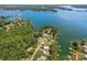 Aerial view of lakefront homes nestled among lush greenery, featuring private docks and stunning water views at 5153 Glenwood St, Sherrills Ford, NC 28673