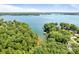 Expansive aerial view of a serene lake surrounded by verdant trees with boat docks along the shore at 5153 Glenwood St, Sherrills Ford, NC 28673