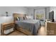 Bedroom features a queen size bed, hardwood floors, and serene views of the lake at 5153 Glenwood St, Sherrills Ford, NC 28673