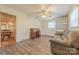 Versatile bedroom with built-in shelves, a desk, and laminate flooring at 5840 Potter Rd, Matthews, NC 28104