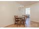 Intimate dining area with seating for four, adjacent to a living space at 5840 Potter Rd, Matthews, NC 28104