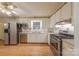 Efficient kitchen equipped with stainless steel appliances and white cabinetry at 5840 Potter Rd, Matthews, NC 28104