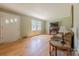 Cozy living room featuring hardwood floors and a charming fireplace at 5840 Potter Rd, Matthews, NC 28104