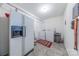 Functional utility room with a refrigerator, washer, and dryer for added convenience at 5840 Potter Rd, Matthews, NC 28104