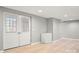 Finished basement area featuring double doors leading to the exterior at 607 Coulwood Dr, Charlotte, NC 28214