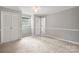 Spacious bedroom with carpet, neutral paint, and dual closets at 607 Coulwood Dr, Charlotte, NC 28214