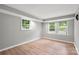 Bedroom with neutral walls and floors and windows looking to the outside at 607 Coulwood Dr, Charlotte, NC 28214