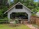 Detached carport featuring a gable roof and parking for two vehicles at 607 Coulwood Dr, Charlotte, NC 28214