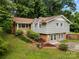 Beautiful exterior showcasing a classic design and landscaped front yard at 607 Coulwood Dr, Charlotte, NC 28214