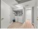 Laundry room with washer, dryer, and storage space at 607 Coulwood Dr, Charlotte, NC 28214