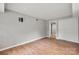 Living room with gray walls, modern flooring, and closet storage at 607 Coulwood Dr, Charlotte, NC 28214