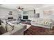 Bright living room with a fireplace, stylish furnishings and hardwood flooring at 607 Coulwood Dr, Charlotte, NC 28214