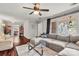 Comfortable living room features a large sectional and view into dining area at 607 Coulwood Dr, Charlotte, NC 28214