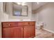 The bathroom features a wooden vanity, large mirror, and a toilet next to a shower-tub combo at 623 Olmsted Park Pl # D, Charlotte, NC 28203