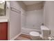 A clean and functional bathroom is equipped with a shower-tub combination, a toilet, and a towel rack at 623 Olmsted Park Pl # D, Charlotte, NC 28203