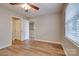 Comfortable bedroom featuring a ceiling fan, neutral walls, and two entry doors at 623 Olmsted Park Pl # D, Charlotte, NC 28203