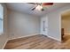 Bright bedroom illuminated with a ceiling fan and has a door with glass panes at 623 Olmsted Park Pl # D, Charlotte, NC 28203
