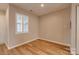 Bright bedroom with hardwood floors and a window at 623 Olmsted Park Pl # D, Charlotte, NC 28203