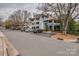 Exterior of apartment building with parking, landscaping and trees at 623 Olmsted Park Pl # D, Charlotte, NC 28203