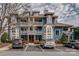 Exterior of apartment building featuring balconies and parking with many cars at 623 Olmsted Park Pl # D, Charlotte, NC 28203