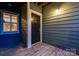 A warm welcome at the front door of the unit, featuring stylish wooden accents and a well-lit entrance at 623 Olmsted Park Pl # D, Charlotte, NC 28203