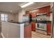 Well-lit kitchen featuring stainless steel appliances, granite countertops, and modern cabinets at 623 Olmsted Park Pl # D, Charlotte, NC 28203