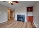 Spacious living room with a cozy fireplace, built-in shelving, and hardwood floors at 623 Olmsted Park Pl # D, Charlotte, NC 28203