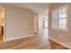 Bright and airy living space with hardwood floors, featuring multiple doorways at 623 Olmsted Park Pl # D, Charlotte, NC 28203