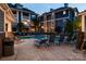 Outdoor community pool with lounge seating and views of apartment buildings at 623 Olmsted Park Pl # D, Charlotte, NC 28203