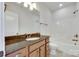 Bathroom with a wood vanity and a bathtub and shower at 750 Waterscape Ct, Rock Hill, SC 29730