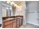 Bathroom featuring double vanity sinks, dark granite countertop, and tile flooring at 750 Waterscape Ct, Rock Hill, SC 29730