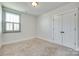 Bedroom with neutral carpet, a window with blinds, and closet for storage at 750 Waterscape Ct, Rock Hill, SC 29730