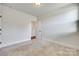 Bedroom with neutral carpet and doorway to hall with hardwood floors at 750 Waterscape Ct, Rock Hill, SC 29730