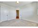 Bedroom with neutral carpet and doorway to hall with hardwood floors at 750 Waterscape Ct, Rock Hill, SC 29730
