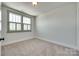 Bedroom with neutral carpet, a window with blinds, and white trim at 750 Waterscape Ct, Rock Hill, SC 29730