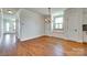 Charming dining room with hardwood floors, chandelier, window seat and view to modern kitchen at 750 Waterscape Ct, Rock Hill, SC 29730