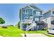 Charming, two-story blue home with a well-maintained lawn and double decks in a desirable community at 750 Waterscape Ct, Rock Hill, SC 29730