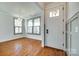 Inviting home foyer with hardwood floors, chandelier and a decorative front door at 750 Waterscape Ct, Rock Hill, SC 29730