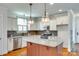 Bright kitchen with granite counters, stainless steel appliances and a large island at 750 Waterscape Ct, Rock Hill, SC 29730